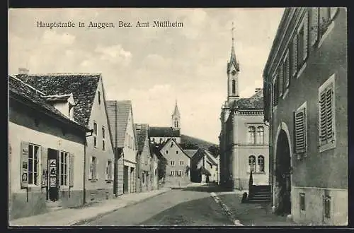 AK Auggen /Bez. Amt Müllheim, Hauptstrasse mit Geschäft und Kirche