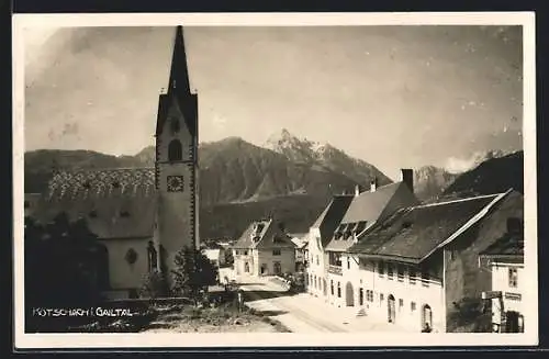 AK Kötschach i. Gailtal, Strassenpartie mit Kirche