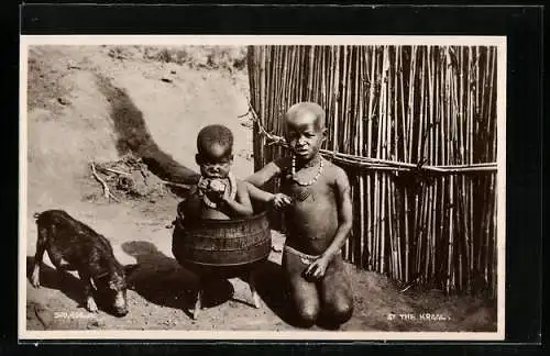 AK Two children and a piglet at the Kraal