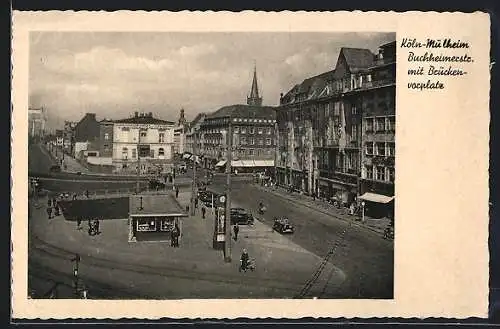 AK Köln-Mülheim, Brückenvorplatz und Buchheimerstrasse mit Geschäften