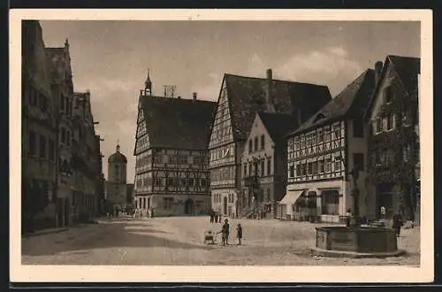 AK Oettingen i. Bay., Strassenpartie mit Brunnen und Turmtor