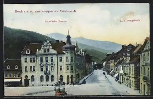 AK Bruck a. d. M., Ecke Hauptplatz und Bismarckstrasse mit historischem Brunnen