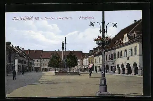 AK Knittelfeld /Steiermarkt, Hauptplatz mit Geschäften und Denkmal