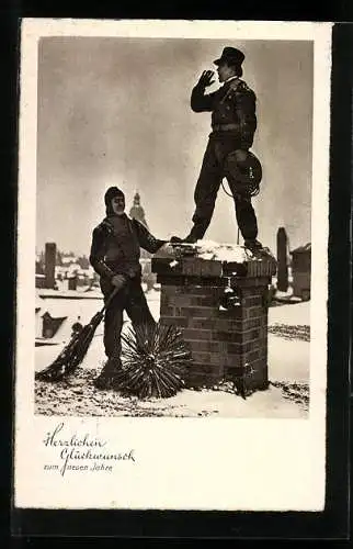 AK Schornsteinfeger auf einem Kamin im Schnee
