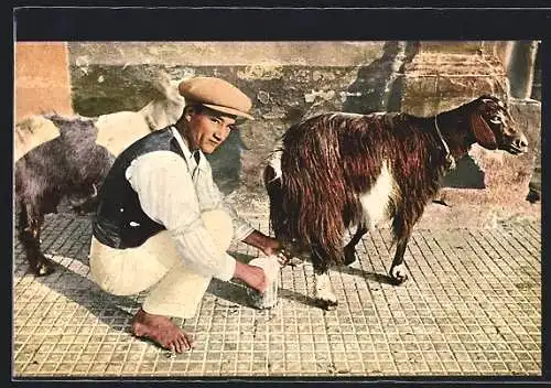 AK Junger Mann beim Melken einer Ziege