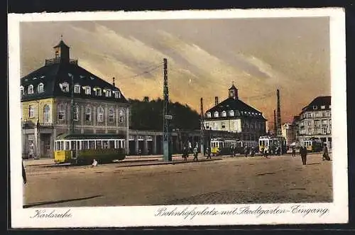 AK Karlsruhe, Bahnhofsplatz mit Stadtgarten-Eingang und Strassenbahn