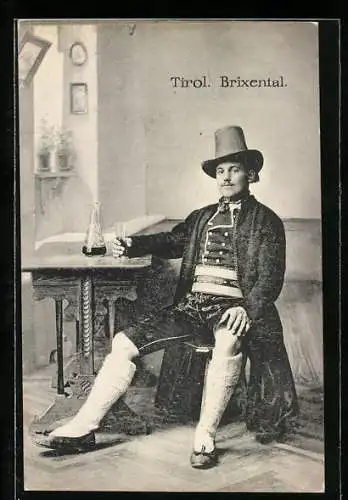 AK Brixental /Tirol, Junger Mann mit einem Glas Wein in Tiroler Tracht
