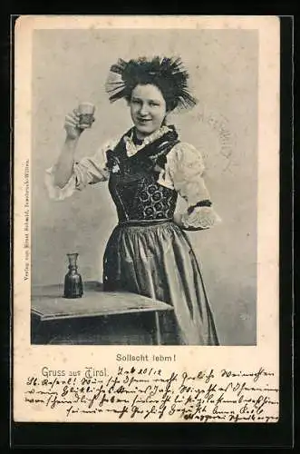 AK Junge Frau prostet in Tiroler Tracht