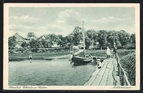 AK Uekeritz a. Usedom, Uferpartie mit einem kleinen Segelboot