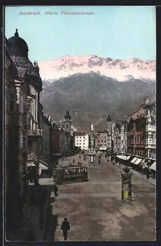 AK Innsbruck, Ortspartie mit Theresienstrasse gegen die Alpen gesehen, Strassenbahn