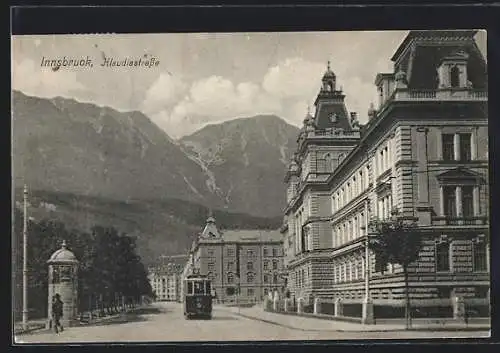 AK Innsbruck, Klaudiastrasse mit Litfasssäule und Strassenbahn