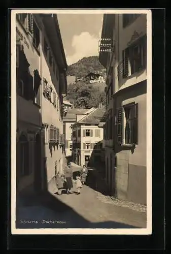 AK Schruns, Dorfstrasse mit Geschäften