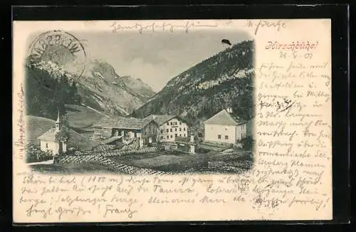 AK St. Martin b. Lofer, Hirschbühel, Kirche- und Häusergruppe mit Gebirgswand