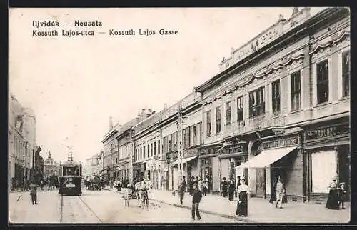 AK Neusatz, Kossuth Lajos Gasse mit Strassenbahn