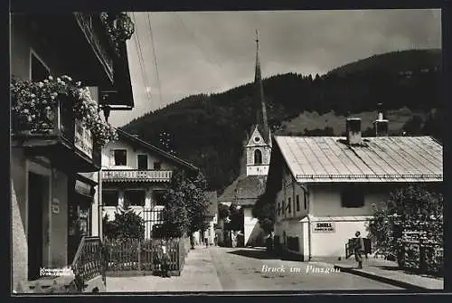 AK Bruck im Pinzgau, Strassenansicht mit Kirche