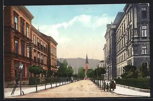 AK Villach, Schulstrasse mit Kirche