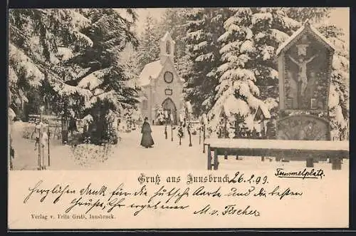 AK Innsbruck, Ortspartie mit Kirche im Schnee