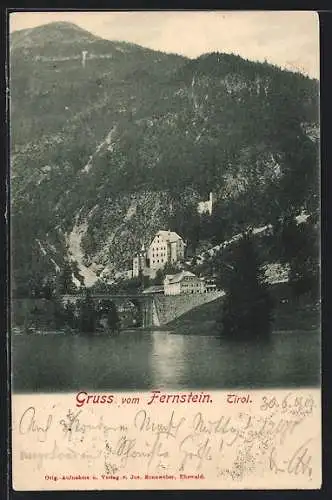 AK Fernstein, Blick übers Wasser zum Ort mit Bergen
