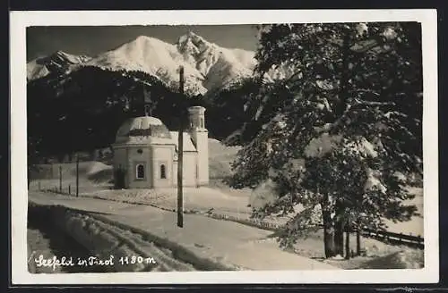AK Seefeld in Tirol, Ortspartie mit Kirche im Winter