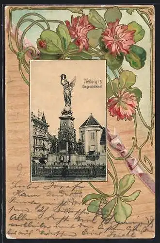 AK Freiburg / Breisgau, Siegesdenkmal, blühender Klee