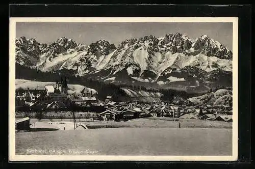 AK Kitzbühel, Ortsansicht im Schnee gegen den Wilden Kaiser