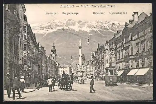 AK Innsbruck, Maria Theresienstrasse mit Strassenbahn, Kemacher, Seegrubensp. und Hafelekar