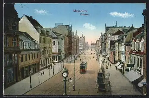 AK Mannheim, Strasse Planken mit Geschäften und Strassenbahn