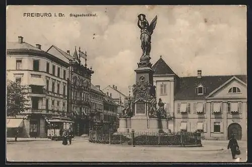 AK Freiburg i. B., Strassenbahn am Siegesdenkmal