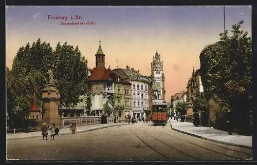 AK Freiburg i. Br., Schwabentorbrücke mit Strassenbahn