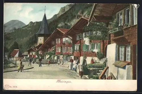 AK Meiringen, Strassenpartie mit Holzhäusern und Anwohnern