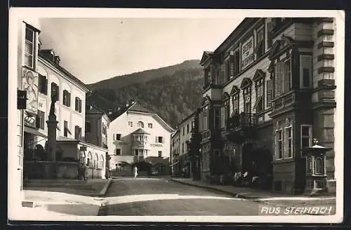 AK Steinach, Wettersäule in Strassenpartie mit Hotel Steinbock