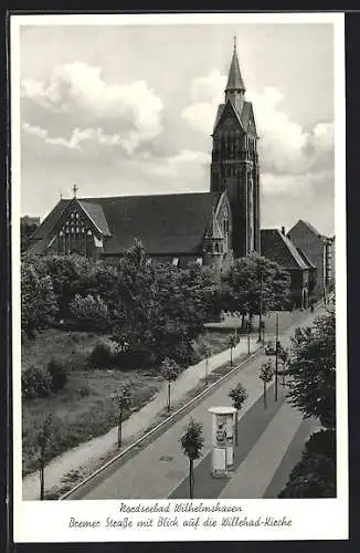 AK Wilhelmshaven, Bremer Strasse mit Litfasssäule und Blick auf die Willehad-Kirche