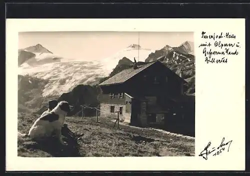 AK Tuxerjochhaus, Wanderer sitzt m. Hund vor der Hütte