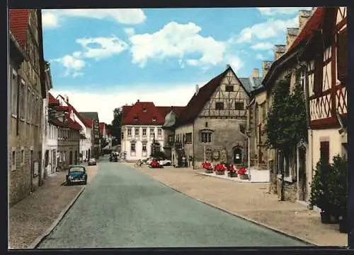 AK Frickenhausen /Main, Strassenpartie mit blauem VW-Käfer