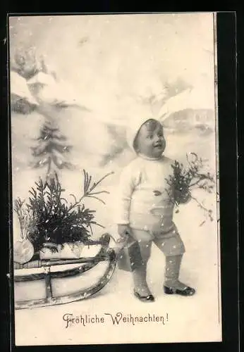 AK Kleinkind mit Mistelstrauss und Schlitten, Weihnachtsgruss