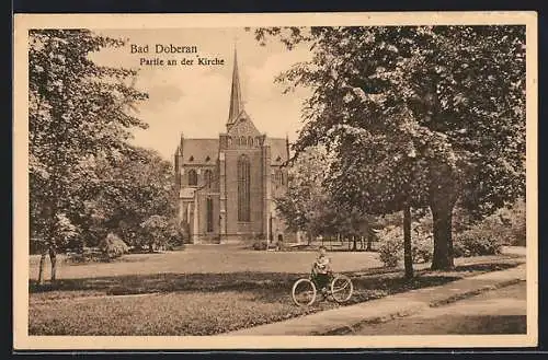 AK Bad Doberan, Kind mit Fahrrad bei der Kirche