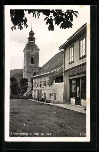 AK Metnitz /Kärnten, Strassenpartie mit Gemischtwarenhandlung Josef Lampl und Kirchturm