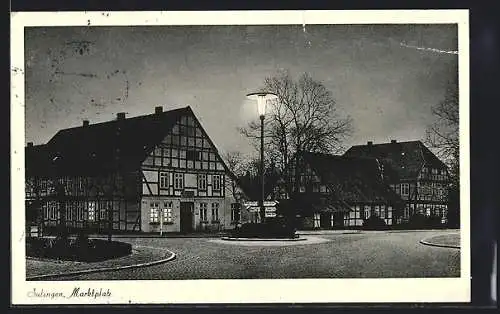 AK Sulingen, Marktplatz mit Gasthaus am Abend