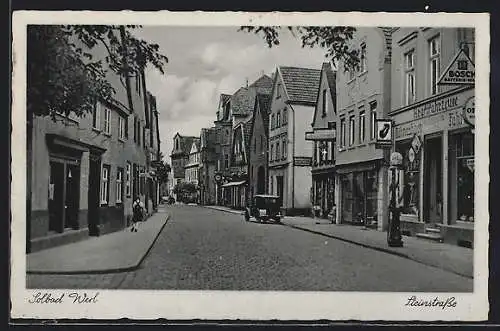 AK Werl, Steinstrasse mit Geschäften