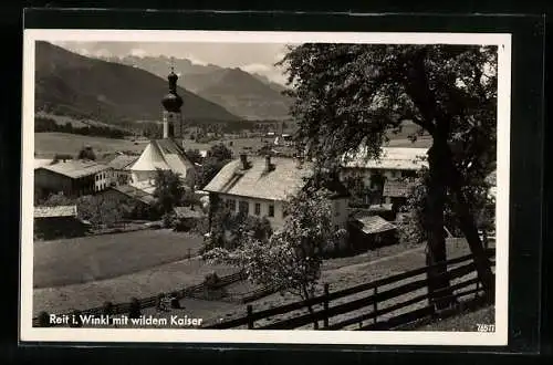 AK Reit i. Winkl, Ortspartie mit Kirche und wildem Kaiser