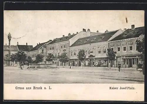 AK Bruck a. L., Kaiser Josef-Platz mit Geschäften und Brunnen