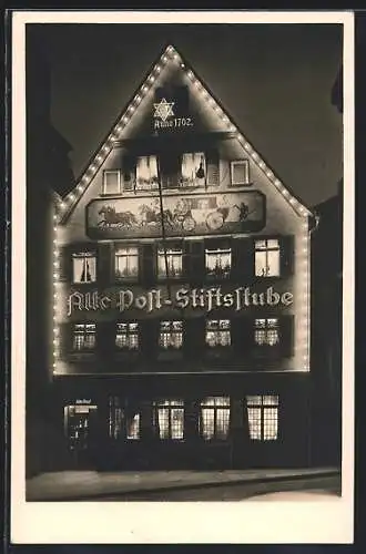 AK Stuttgart, Gasthaus Alte Post-Stiftsstube beleuchtet bei Nacht