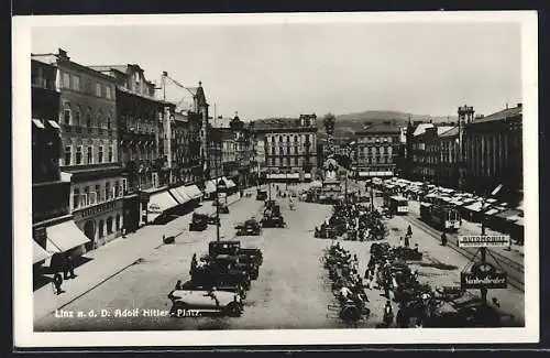 AK Linz a. d. D., Platz mit Hotel Wolfinger und Denkmal, Strassenbahn