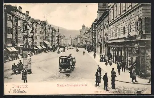 AK Innsbruck, Maria-Theresienstrasse mit Geschäften und Standuhr