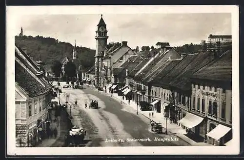 AK Leibnitz, Hauptplatz mit Geschäften und Blick zum Rathaus