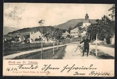 AK St. Johann, Ortsansicht, Mann mit Fahrrad