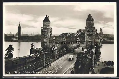 AK Köln, Hohenzollernbrücke mit Pressa, Zug