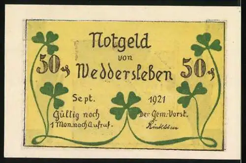 Notgeld Weddersleben 1921, 50 Pfennig, Landschaft mit Fachwerkhäusern und Bäumen, gelb-grüne Rückseite mit Kleeblatt