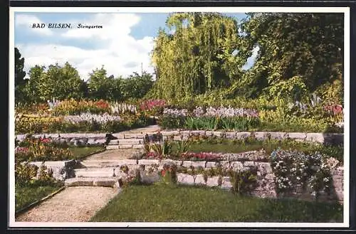 AK Bad Eilsen, Steingarten mit Blumen