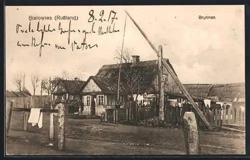 AK Bialowies, Dorfpartie mit Brunnen